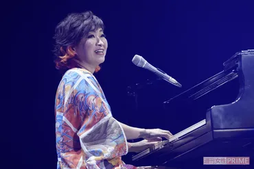 毒と愛情を込めて年、モノマネ女王・清水ミチコは音楽と笑いの融合を突き詰め続けるトップランナー、独自の笑いの原点とは?芸の神髄をクローズアップ